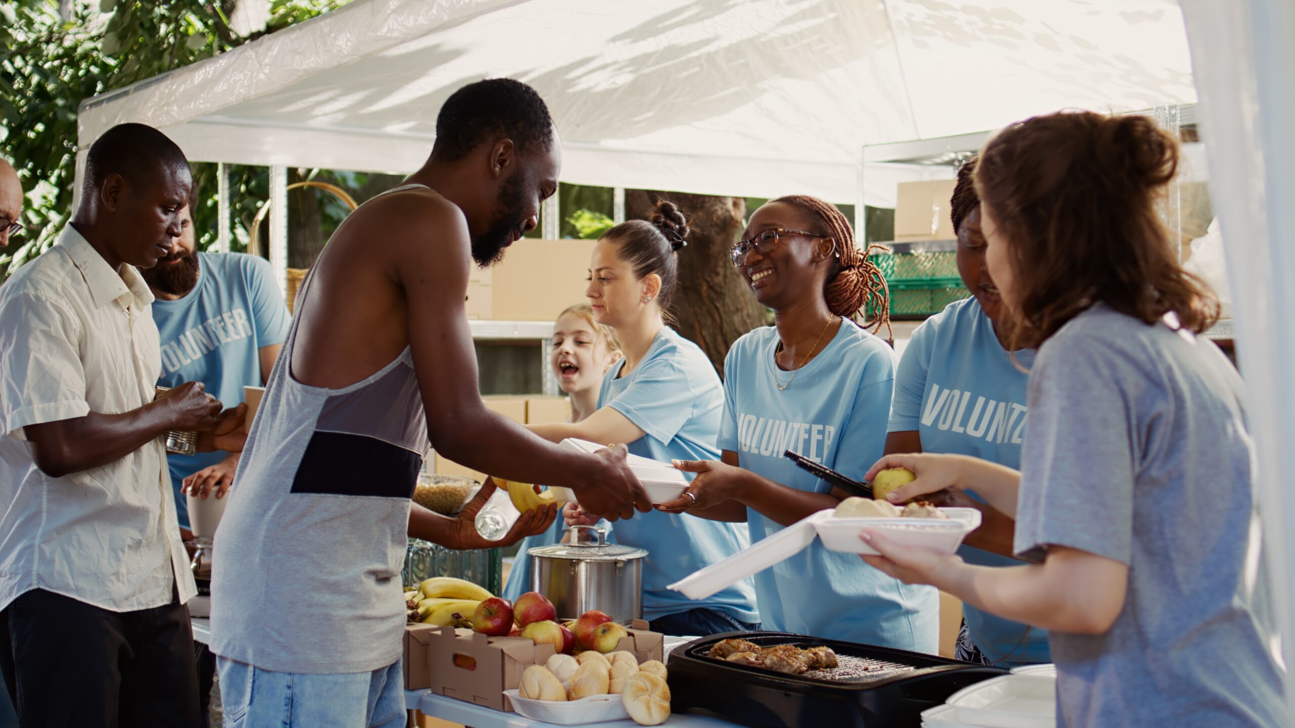 Volunteers serving hot meals in the community